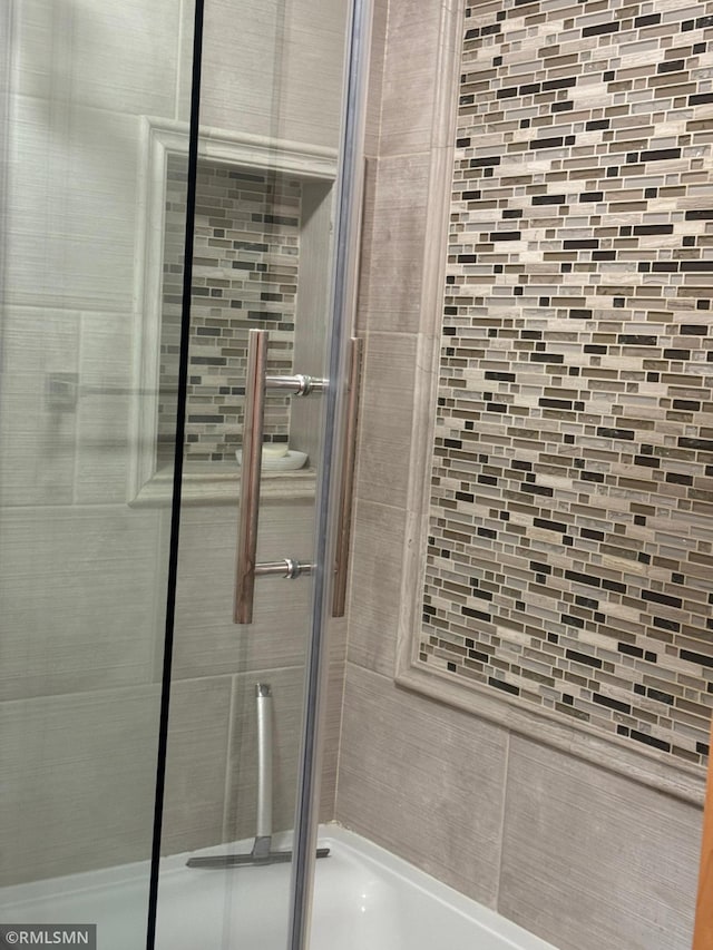 full bathroom featuring a shower stall