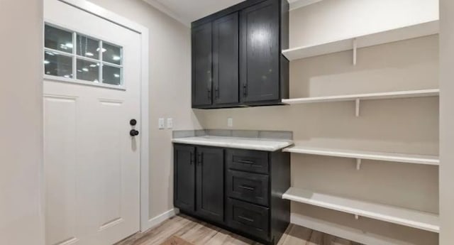 000 Pine Ave S, Sandstone, MN 55072 - laundry area featuring light wood-type flooring and baseboards