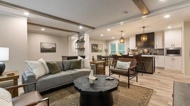 000 Pine Ave S, Sandstone, MN 55072 - living area featuring beam ceiling, recessed lighting, and light wood-style floors