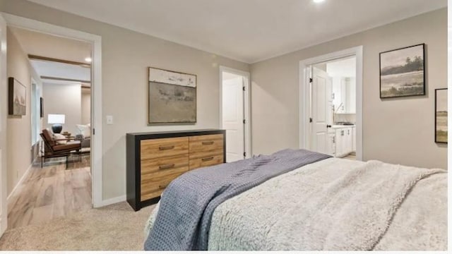 000 Pine Ave S, Sandstone, MN 55072 - bedroom with light carpet, recessed lighting, and ensuite bath