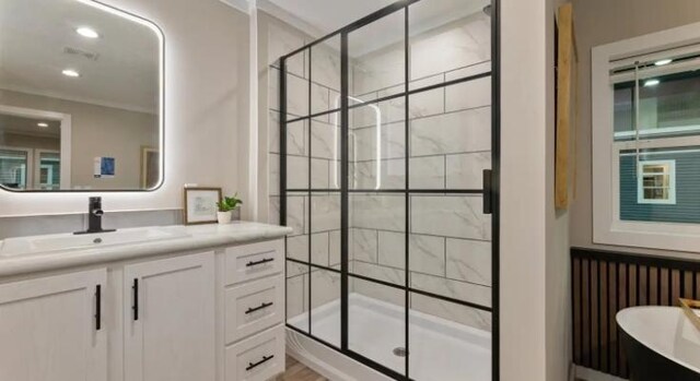 000 Pine Ave S, Sandstone, MN 55072 - bathroom with a stall shower, vanity, a freestanding tub, and recessed lighting