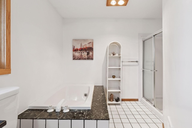 828 143rd St, Garfield Twp, WI 54001 - bathroom featuring a bath, a shower stall, toilet, and tile patterned floors