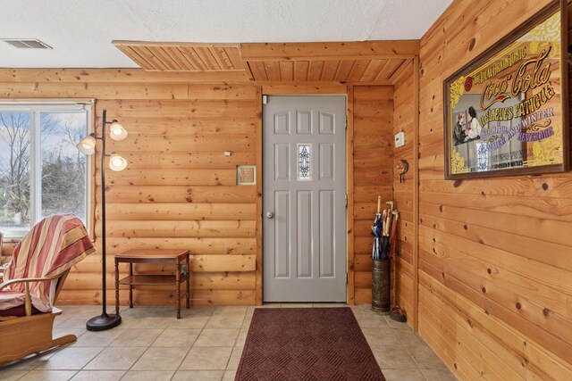 828 143rd St, Garfield Twp, WI 54001 - entryway featuring rustic walls, light tile patterned floors, and wooden ceiling