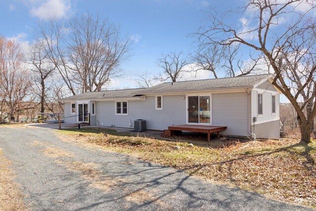 828 143rd St, Garfield Twp, WI 54001 - rear view of house with central AC unit and asphalt driveway