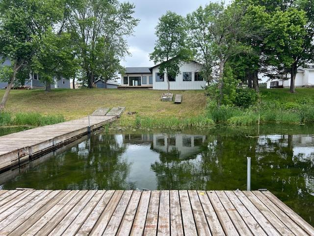 123 River View Rd, Ottertail, MN 56571 - dock area featuring a water view and a yard
