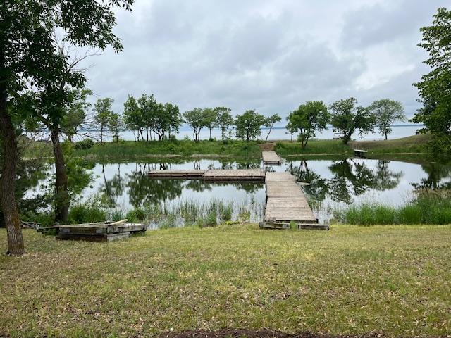 123 River View Rd, Ottertail, MN 56571 - dock area featuring a water view and a yard