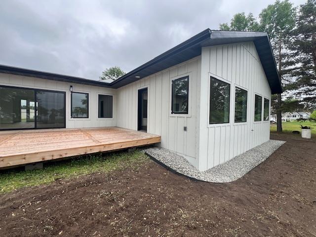 123 River View Rd, Ottertail, MN 56571 - back of house with a wooden deck and board and batten siding