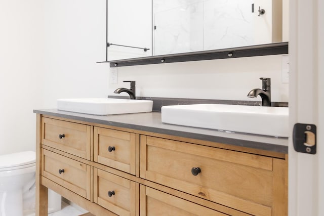123 River View Rd, Ottertail, MN 56571 - bathroom featuring double vanity and toilet