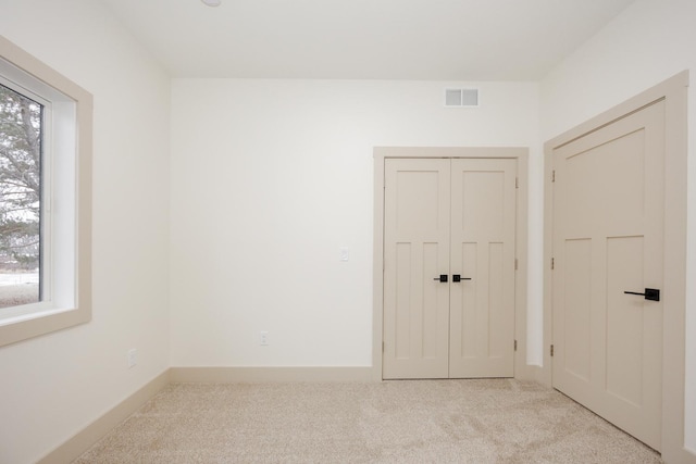 123 River View Rd, Ottertail, MN 56571 - empty room with light colored carpet and healthy amount of natural light