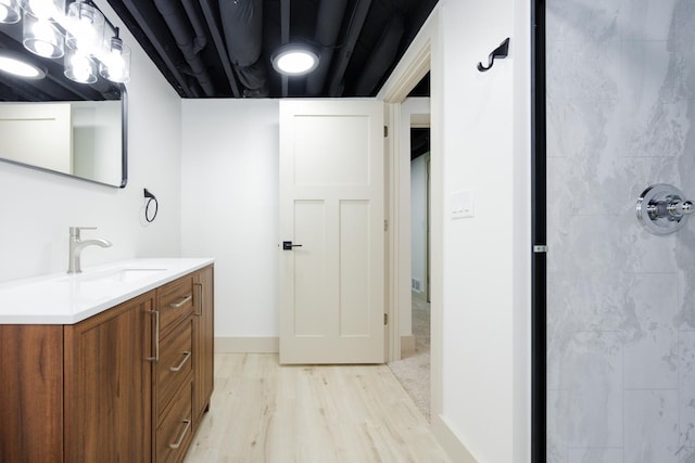 123 River View Rd, Ottertail, MN 56571 - bathroom with vanity, wood finished floors, and a tile shower