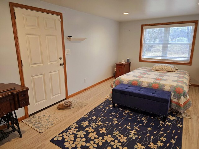 1100 16th Ave NE, Austin, MN 55912 - bedroom featuring baseboards, light wood-style floors, and recessed lighting