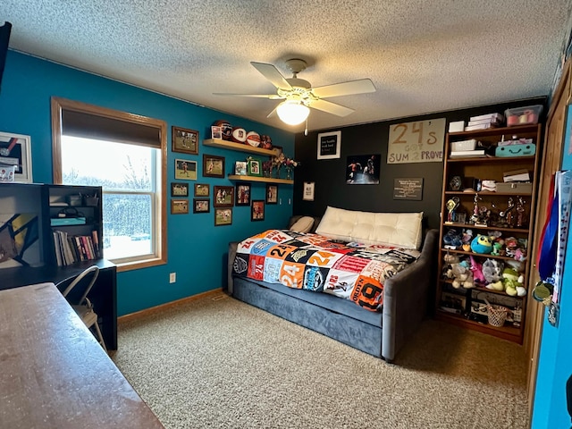 carpeted bedroom featuring baseboards, a textured ceiling, and ceiling fan