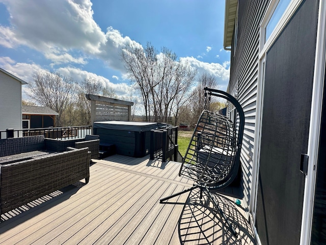 deck featuring a hot tub
