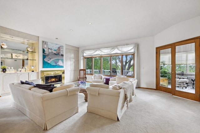 8991 Ferndale Ln, Eden Prairie, MN 55347 - living area featuring built in features, baseboards, carpet flooring, and a glass covered fireplace
