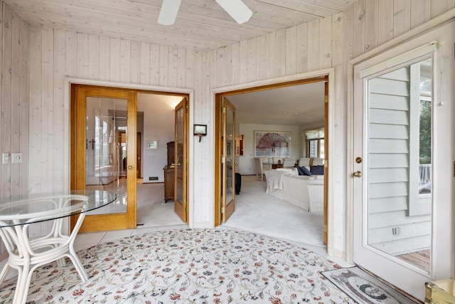 8991 Ferndale Ln, Eden Prairie, MN 55347 - hall with wood ceiling, wood walls, and carpet
