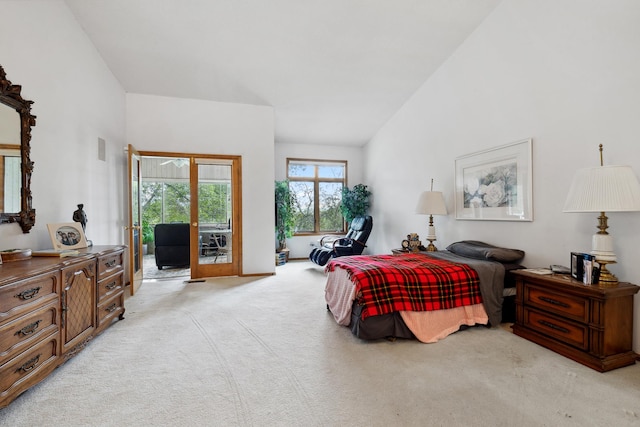 8991 Ferndale Ln, Eden Prairie, MN 55347 - bedroom with high vaulted ceiling, access to outside, and light colored carpet