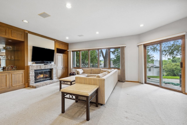 8991 Ferndale Ln, Eden Prairie, MN 55347 - living room featuring recessed lighting, a fireplace, light colored carpet, and baseboards