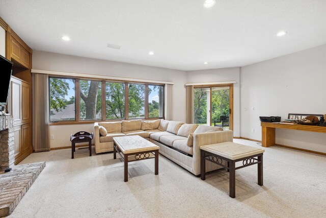 8991 Ferndale Ln, Eden Prairie, MN 55347 - living room with baseboards, recessed lighting, light colored carpet, and a fireplace