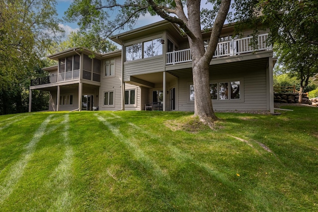 8991 Ferndale Ln, Eden Prairie, MN 55347 - rear view of property featuring a sunroom and a lawn