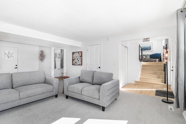 493 Rolls Rd, New Brighton, MN 55112 - carpeted living area with stairs