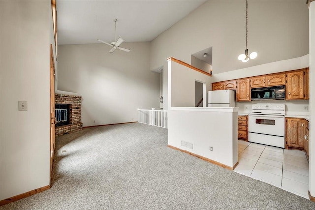 kitchen with high vaulted ceiling, ceiling fan with notable chandelier, open floor plan, white appliances, and light carpet