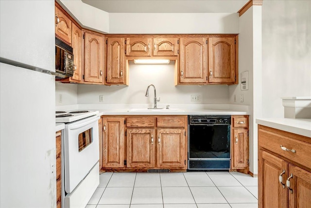 kitchen with light countertops, brown cabinetry, a sink, and black appliances