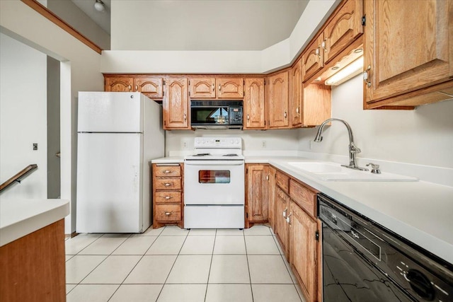 kitchen with a sink, black appliances, brown cabinets, light tile patterned floors, and light countertops