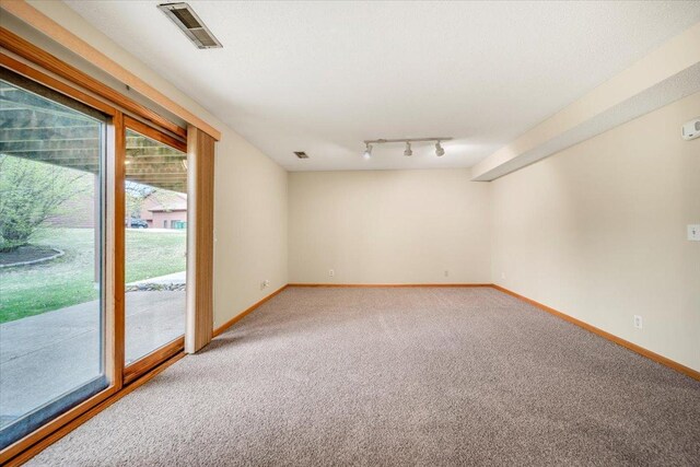 unfurnished room featuring light carpet, baseboards, and visible vents