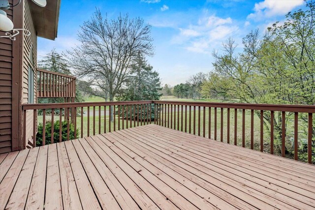 wooden terrace with a yard