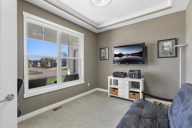 sitting room featuring visible vents, carpet, crown molding, and baseboards
