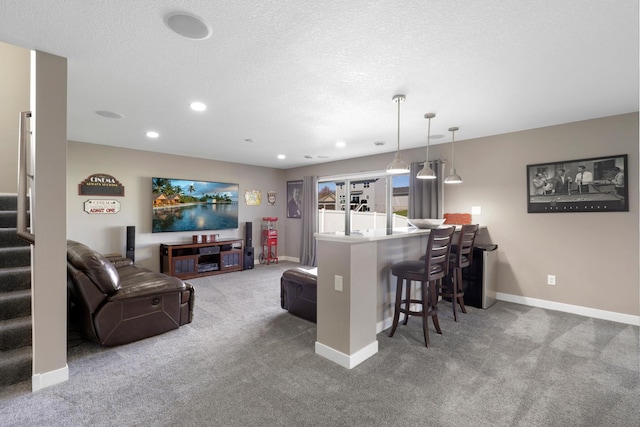 interior space with baseboards, recessed lighting, carpet, and a kitchen bar