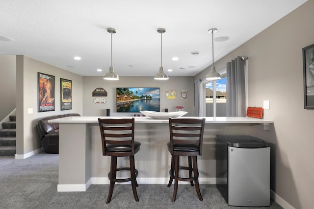 bar with decorative light fixtures, stairway, baseboards, carpet, and indoor bar