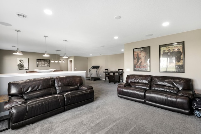 living area featuring carpet flooring, recessed lighting, baseboards, and visible vents
