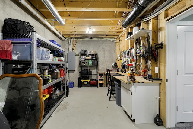 interior space featuring a workshop area and electric panel