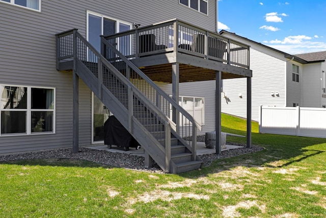exterior space featuring a wooden deck, a yard, and cooling unit