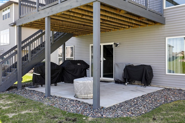 view of patio with stairway and area for grilling