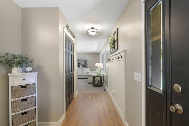36090 Helium St NW, Wyanett Twp, MN 55371 - corridor with baseboards and light wood finished floors