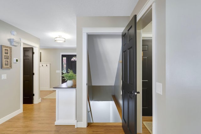 36090 Helium St NW, Wyanett Twp, MN 55371 - corridor featuring light wood finished floors and baseboards