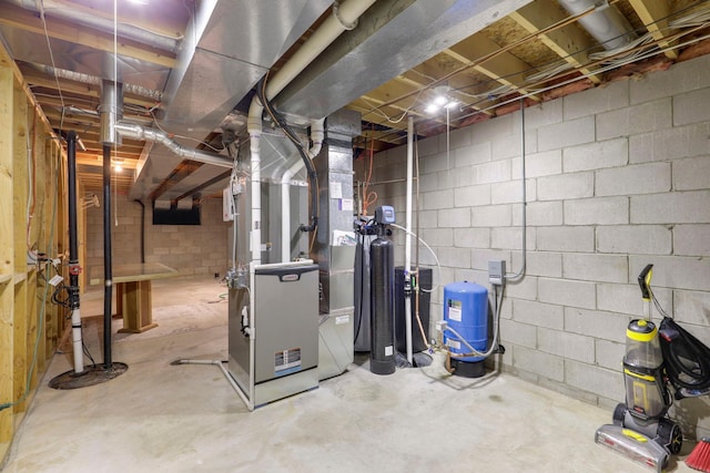 36090 Helium St NW, Wyanett Twp, MN 55371 - unfinished basement with a water pressure tank, heating unit, and a water softener
