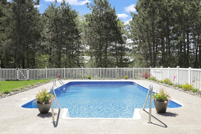 36090 Helium St NW, Wyanett Twp, MN 55371 - view of pool with a fenced backyard and view of wooded area