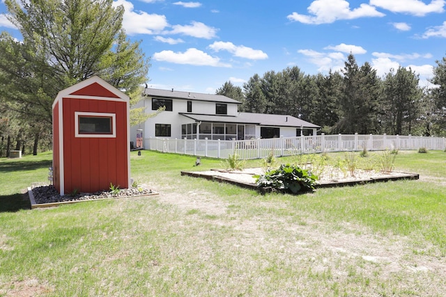 36090 Helium St NW, Wyanett Twp, MN 55371 - view of yard featuring a storage shed and a sunroom