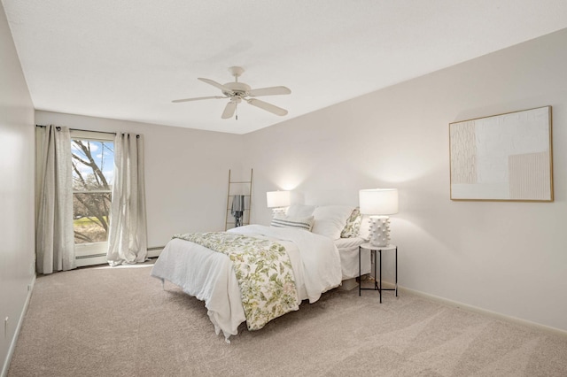 carpeted bedroom featuring baseboards and ceiling fan