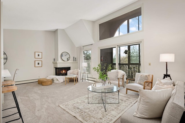 living room featuring a large fireplace, a towering ceiling, carpet floors, and a baseboard radiator