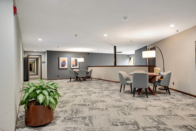 carpeted dining area with baseboards and recessed lighting
