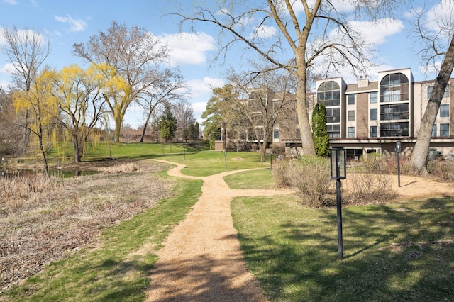 view of home's community featuring a lawn
