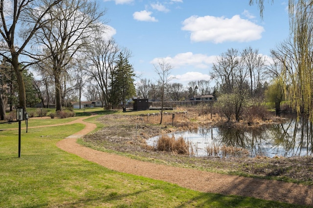exterior space featuring a yard and a water view