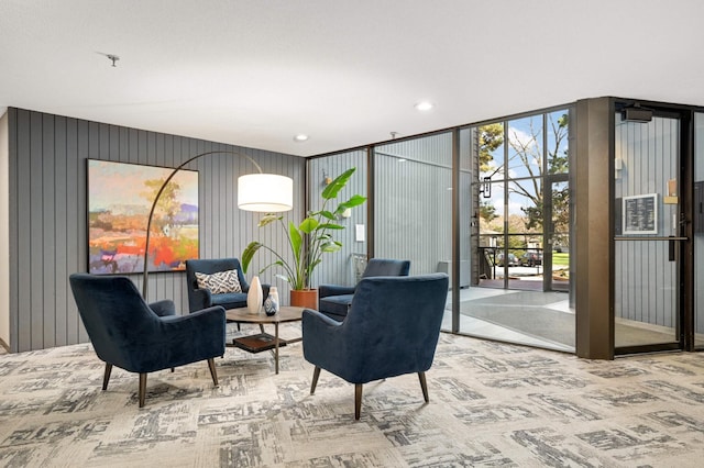 living area featuring recessed lighting and carpet flooring