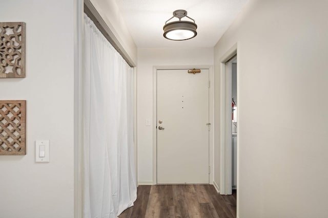 hallway featuring dark wood-style floors