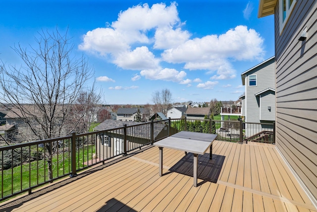 wooden deck featuring a residential view