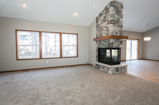 unfurnished living room with high vaulted ceiling, carpet, baseboards, a fireplace, and recessed lighting